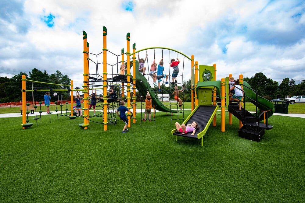Children playing on school playground with synthetic turf surfacing